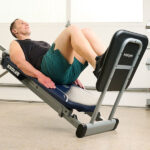 Model using Total Gym Deluxe Squat Stand